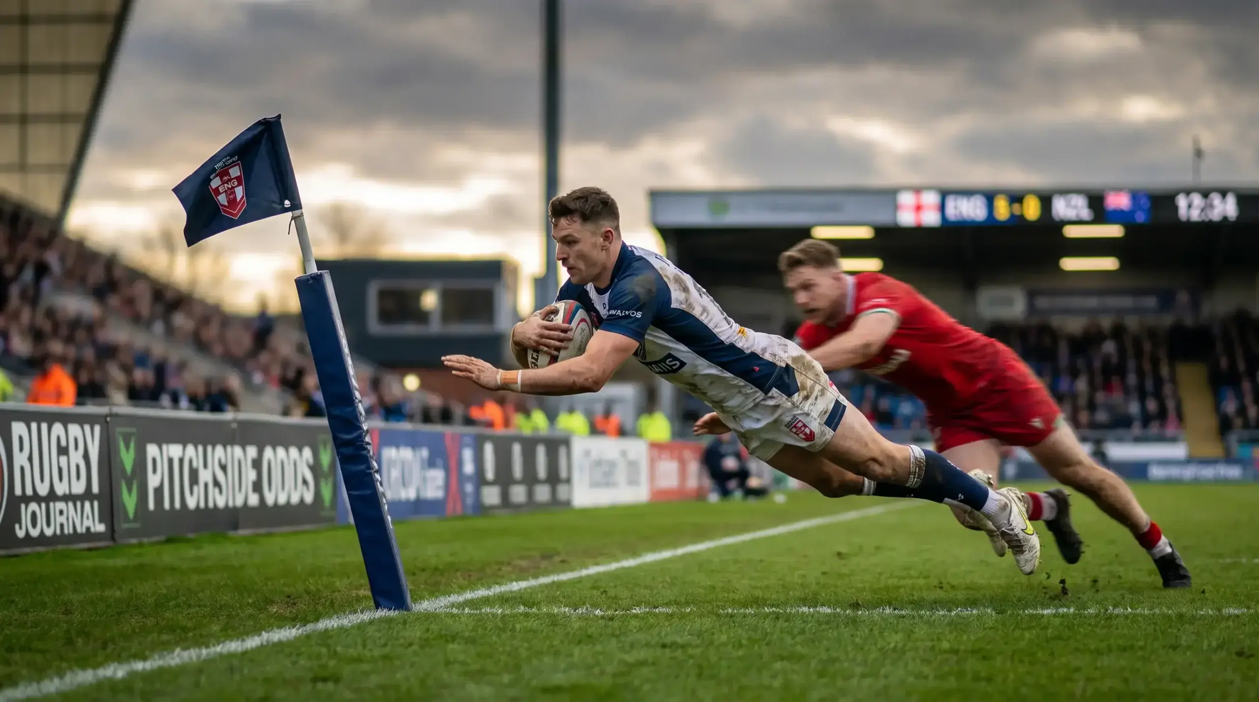 Rugby union winger diving over in the corner to score the first try of the match