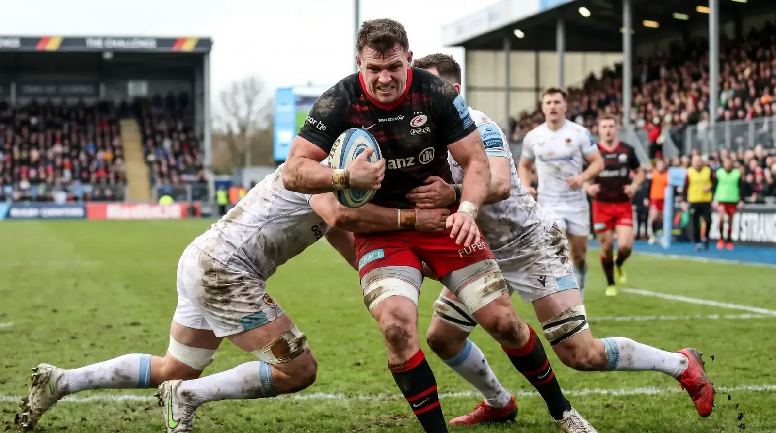 Rugby forward carrying the ball into contact to build carry and metre stats